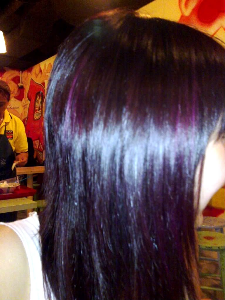 Black hair with purple and blue streaks and some coontails